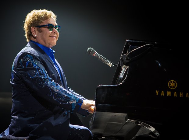 Elton John at his piano