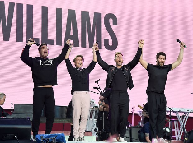 Robbie Williams with Take That during live One Lov