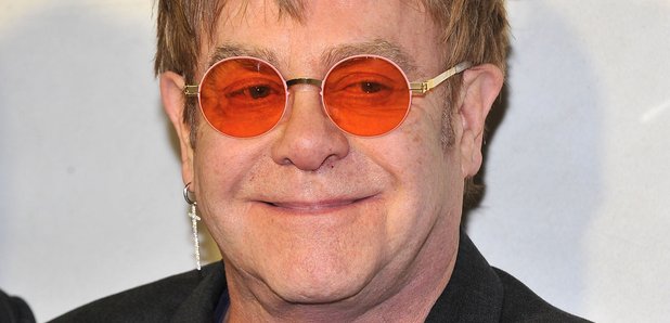Elton in orange glasses