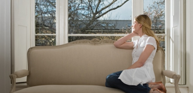 Woman looking out window