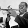 Image 6: Louis Armstrong playing instrument