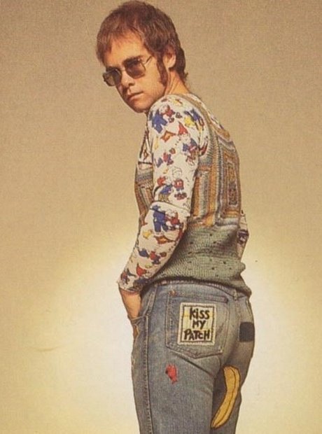 Elton John in denim and a waistcoat - Elton John's 10 ...