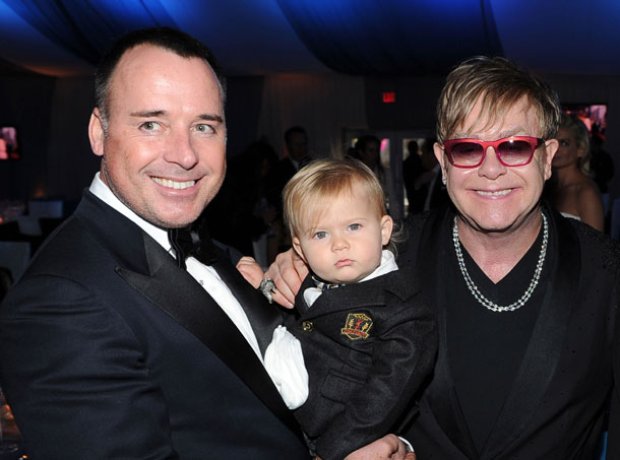 Elton John and David Furnish with son