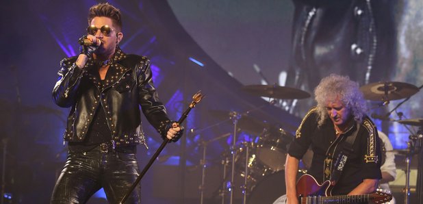 Adam Lambert and Brian May of Queen performing on