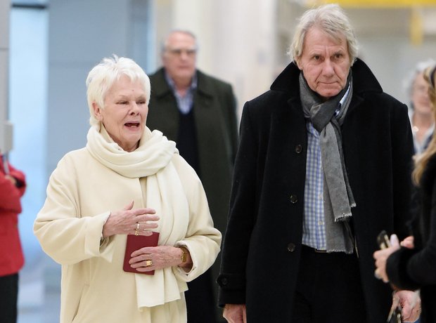 Dame Judi Dench, with partner David Mills, arrive at JFK airport in NYC ...