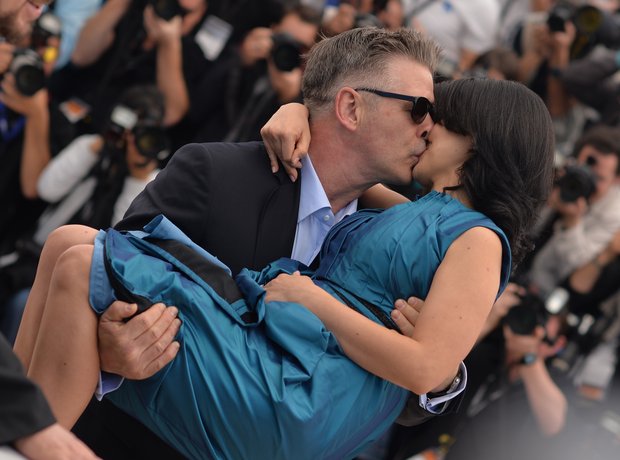 Alec Baldwin kisses wife Hilaria Thomas.