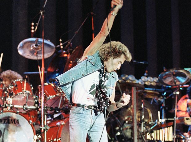 Roger Daltry singer of The Who performing on stage