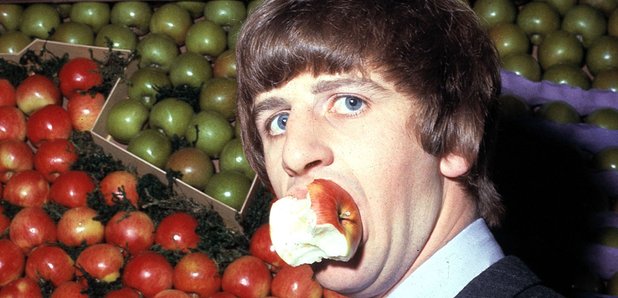 Ringo Starr eating an apple