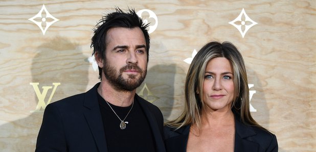 Jennifer Aniston and husband Justin Theroux look p