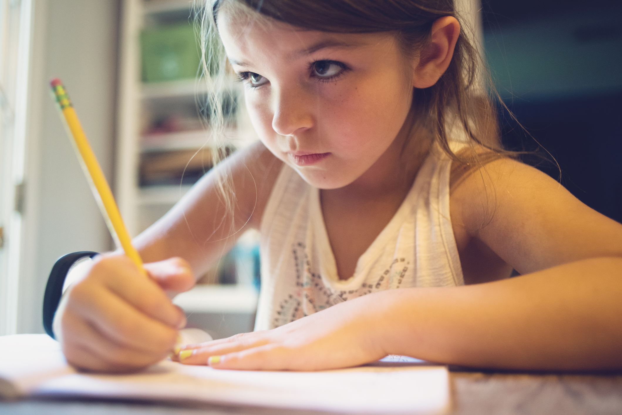 kid holding a pencil png