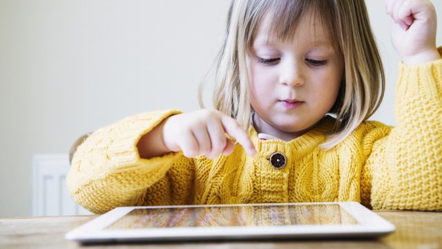 Child and tablet