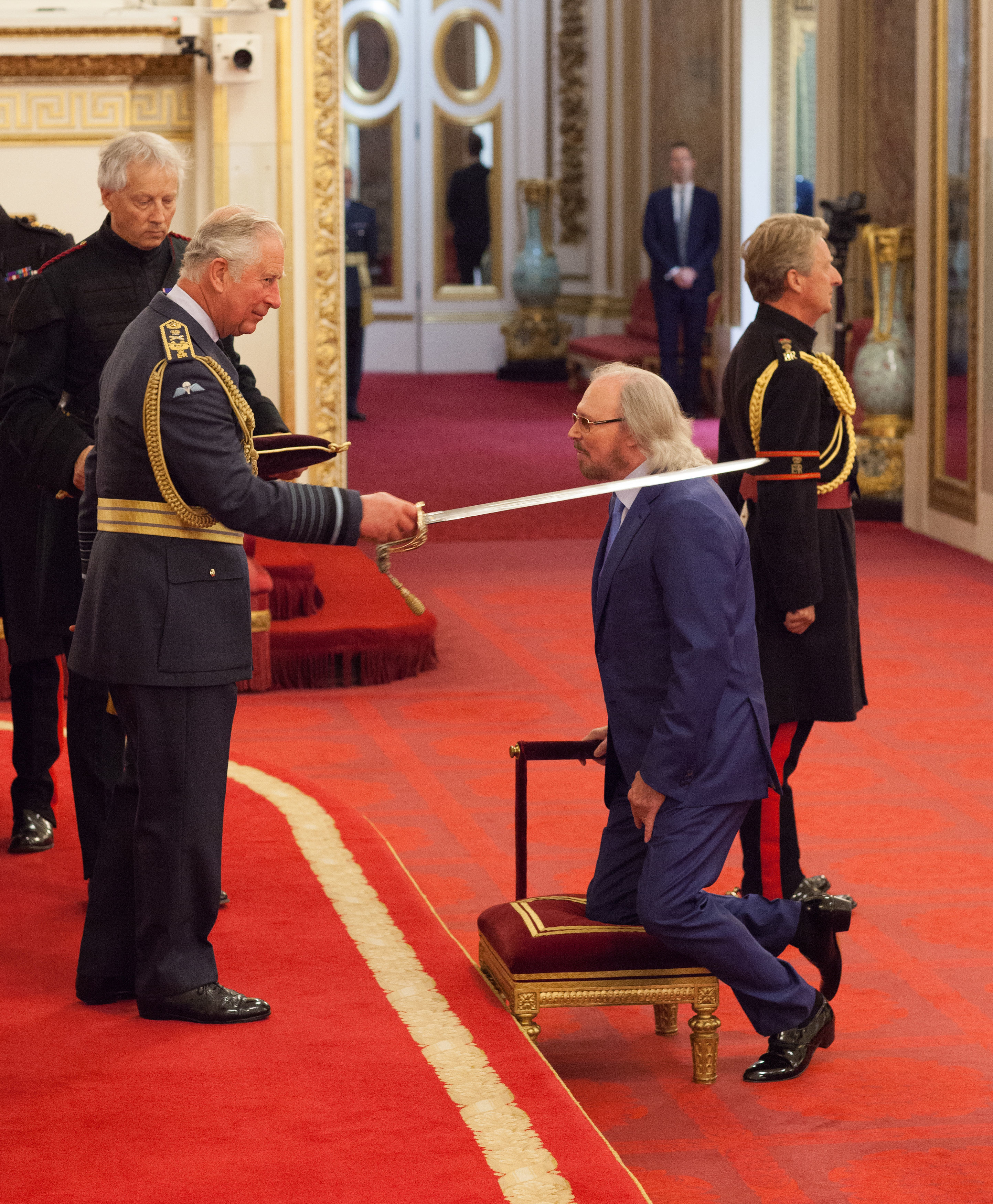 Barry Gibb receives his knighthood from Prince Cha